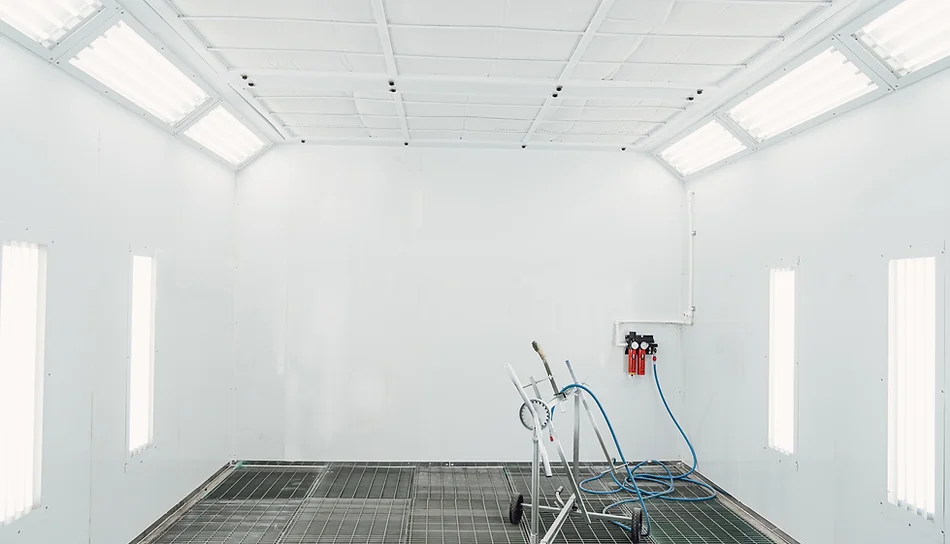 Painting of vehicles in a room with a filter and good light. Spray paint cabinet in a car